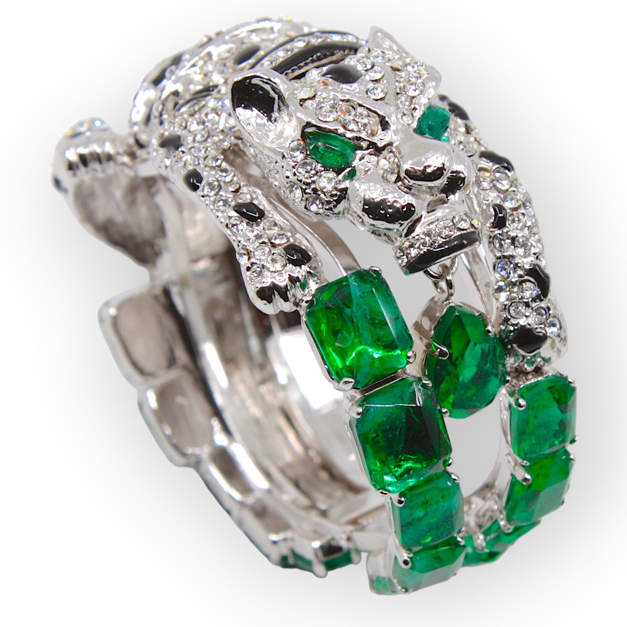 Luxurious Swarovski® crystals inform the exclusive design of this remarkable panther bracelet with emerald crystals and enamel, crafted from hypoallergenic rhodium-plated metal. Superior craftsmanship renders each piece one-of-a-kind. These items are skilfully fabricated in Italy with luxurious crystals.