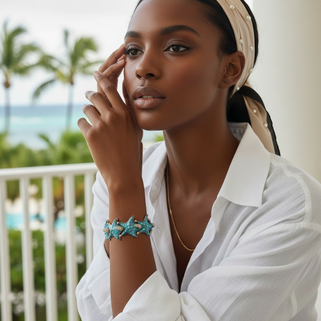 Starfish charm bracelet in hand-enamelled 24 kt gold plated brass with Swarovski crystal details, Made in Italy