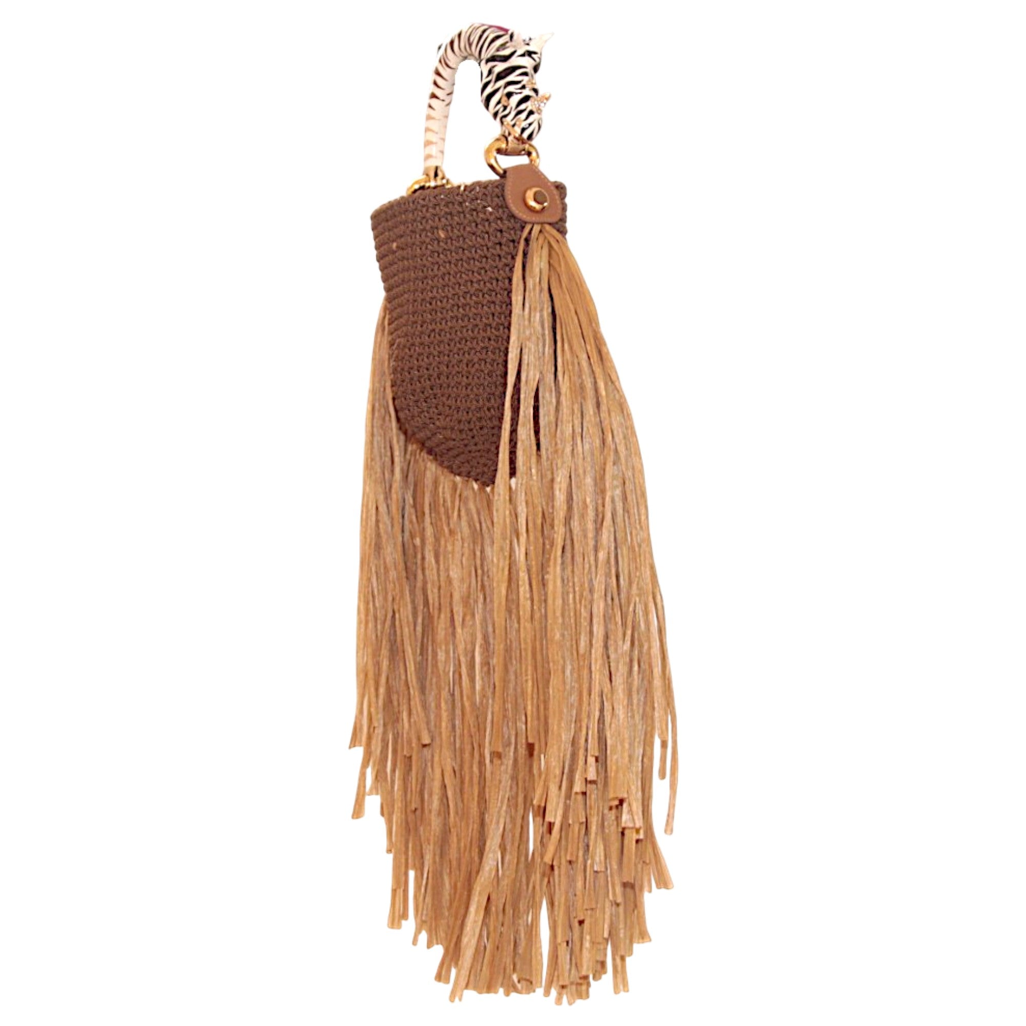 Handwoven textile and raffia bag with dramatic fringes and rhinoceros-inspired sculptural handle. Part of the Saint Tropez Collection selected by INGASIRMIONE.